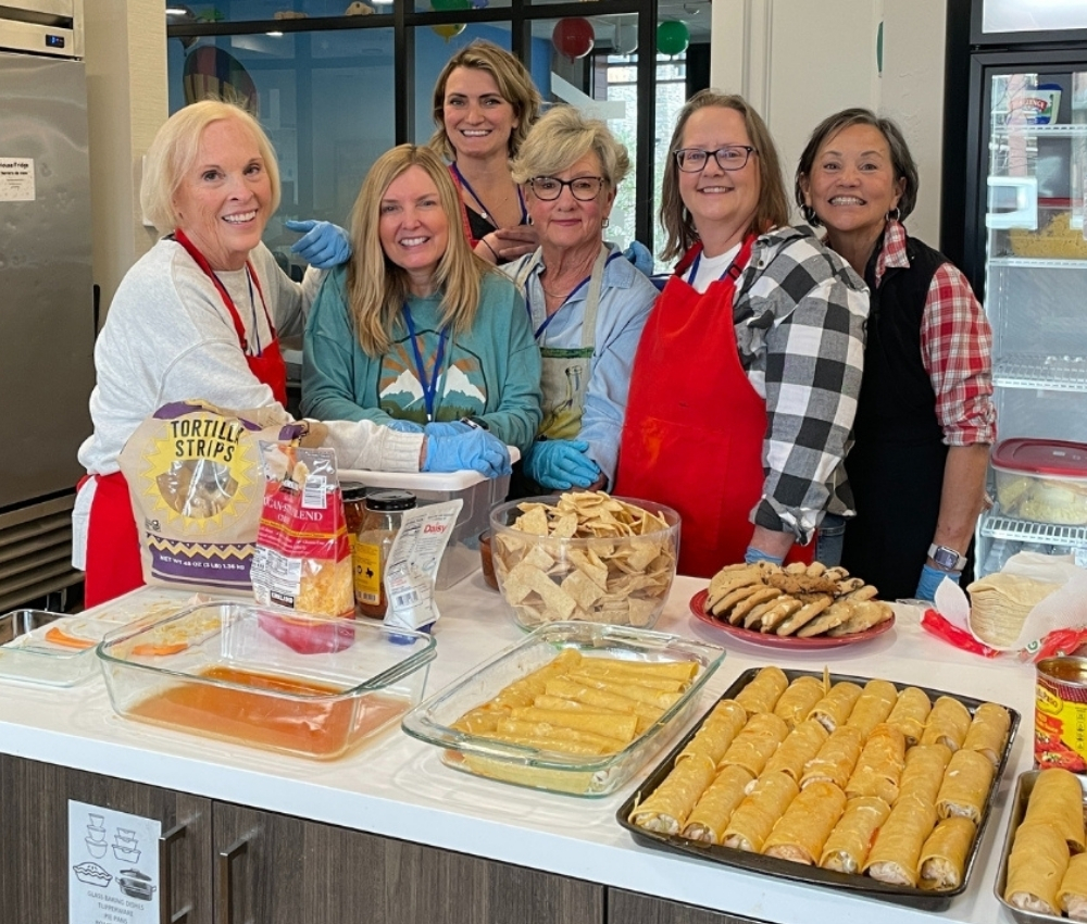 Volunteers cooking at the House.
