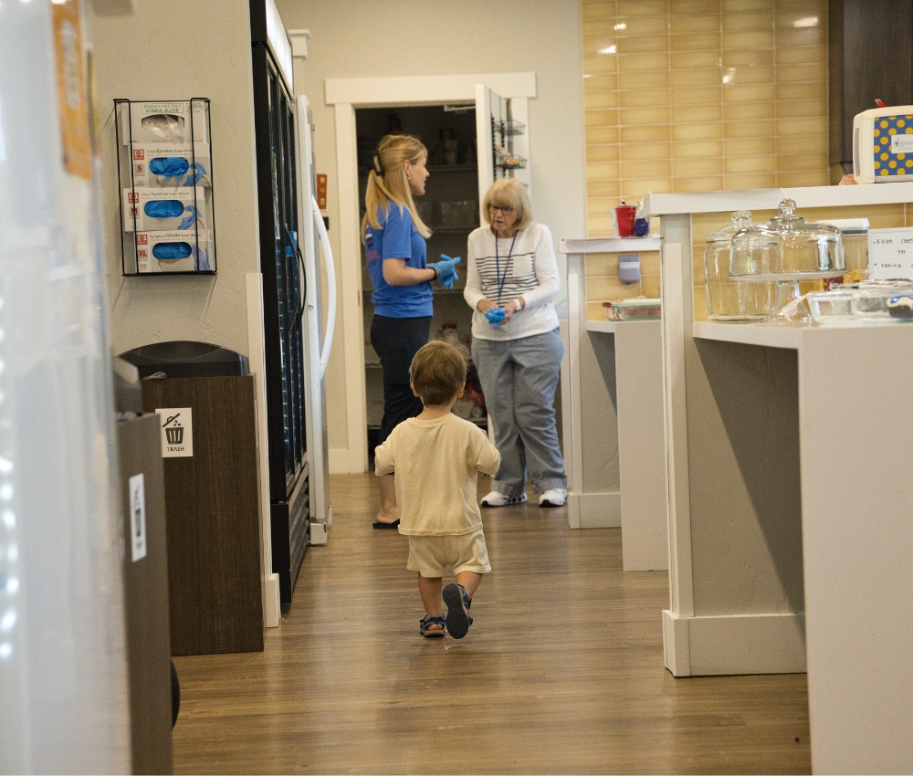 Family talking in the kitchen at the House.